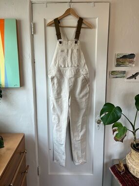 REI Cream Carpenter-Style Denim Overalls with elastic brown Straps